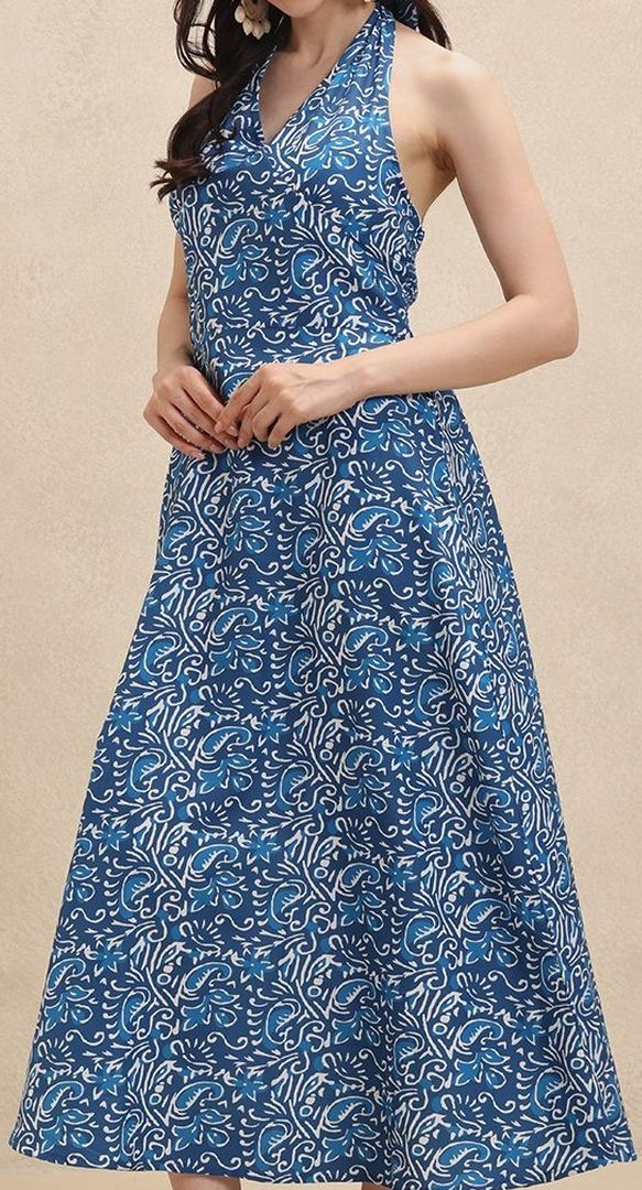 Flowing floral print halterneck maxi dress for women. Ideal elegant summer fashion or a stylish vacation dress.