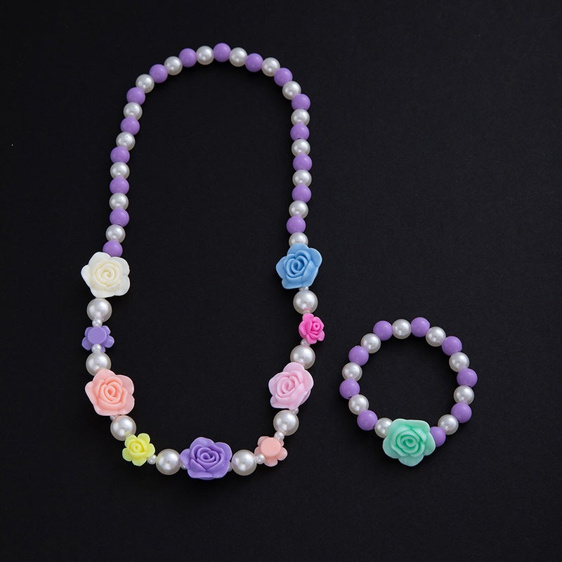 Ideal elegant gift: floral jewelry set for women, featuring a pastel pearl necklace & matching bracelet.