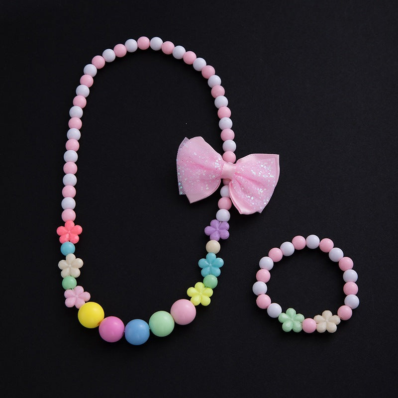 Stunning elegant floral jewelry set for women, necklace, bracelet, and charming pastel pearl accents.