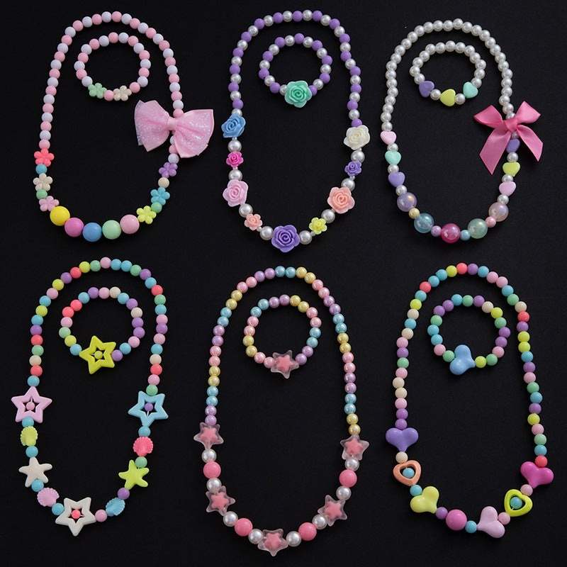Close-up: Elegant women's floral motif necklace with pastel pearls. Beautiful fashion jewelry for women.