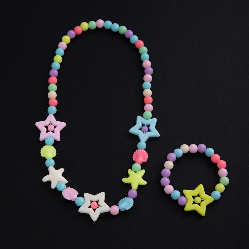 Pastel pearl accents on an elegant floral jewelry set for women, including necklace & bracelet. Fashionable.