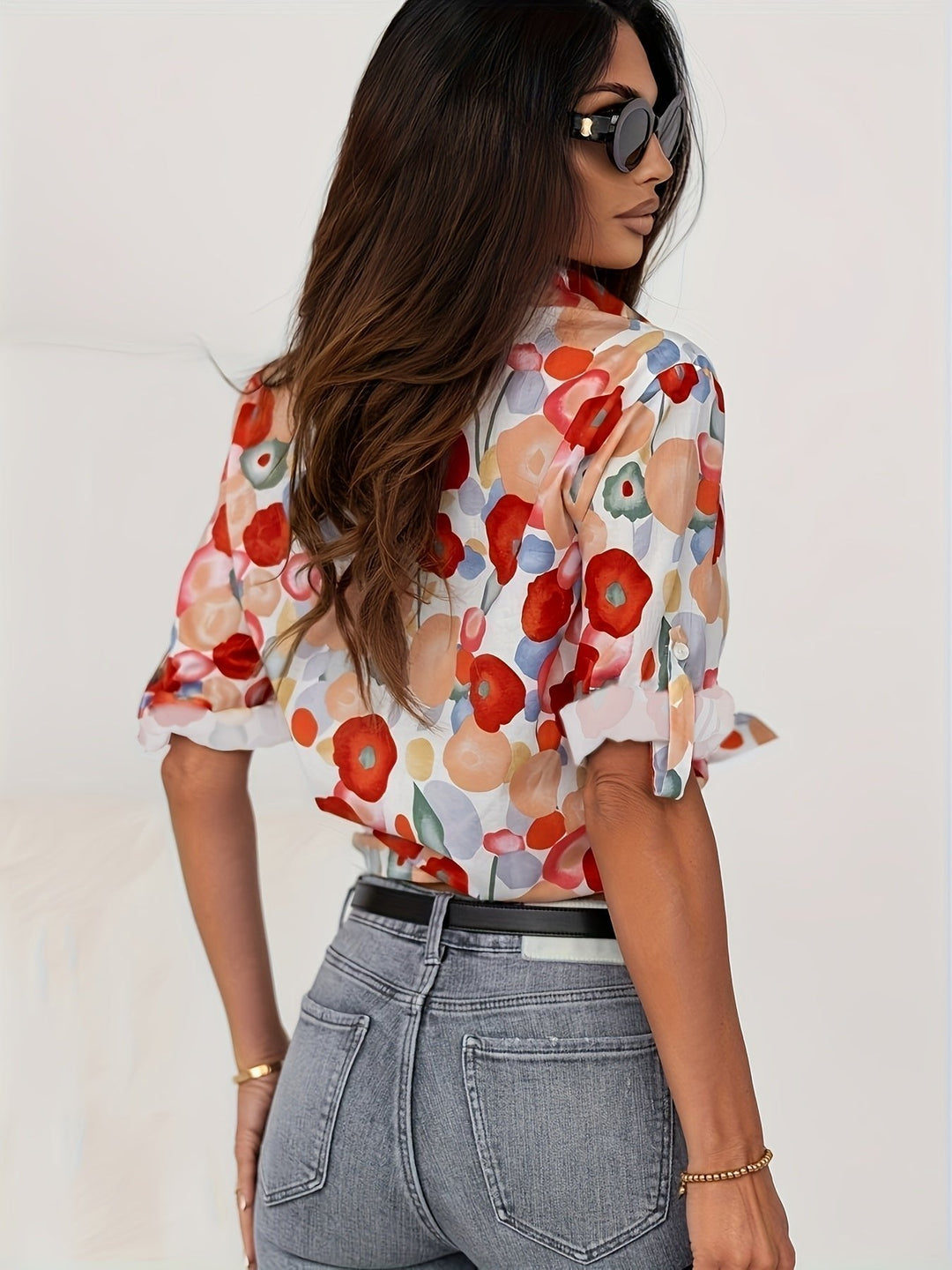 Stylish women's long sleeve floral button-down blouse. Elegant print shirt for spring, great for office or casual wear.