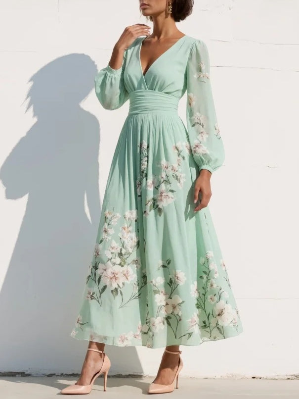 Women's stylish floral pleated midi dress, featuring a V-neck and long sleeves, ideal for elegant occasions.