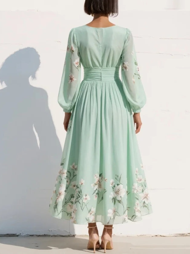 Graceful women's floral long sleeve V-neck midi dress with delicate pleats, suitable for formal wear.