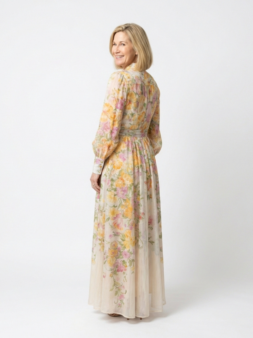 Flowy patterned long sleeve maxi dress for women, featuring a vibrant floral print and elegant silhouette.