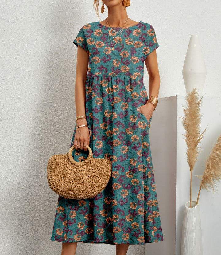 Beautiful women's floral midi dress for spring/summer. Elegant, flowy fabric with a vibrant flower pattern.