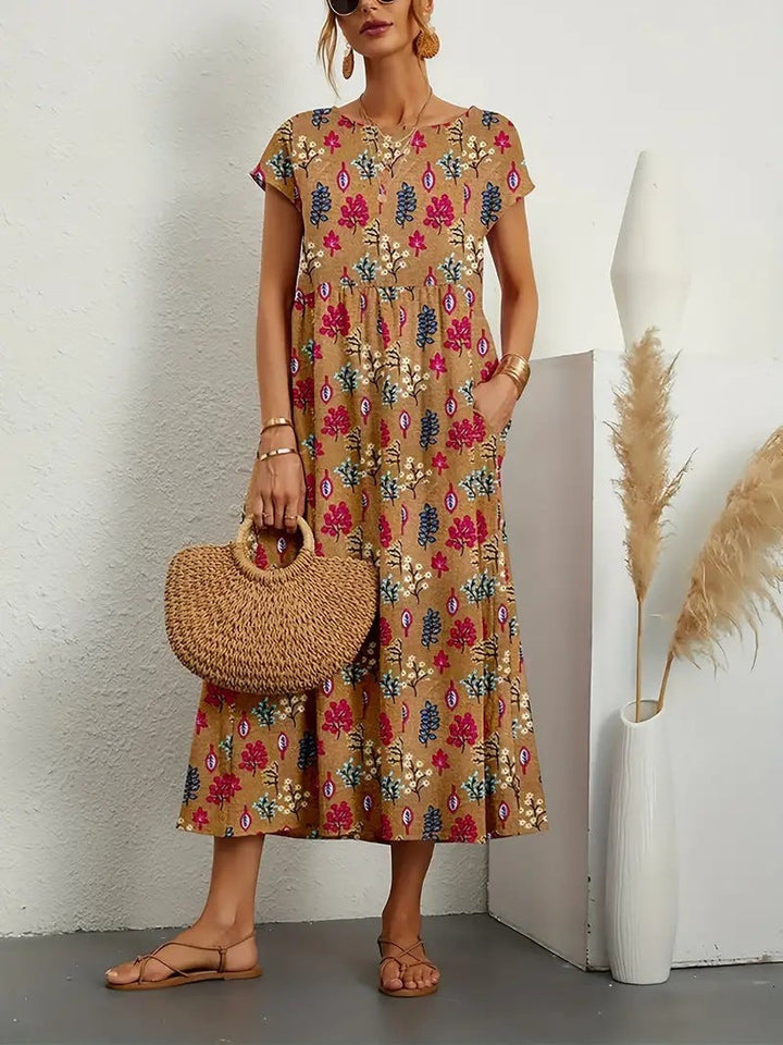Stylish women's floral print midi dress with a comfortable, flowy fit. An elegant choice for summer or spring events.