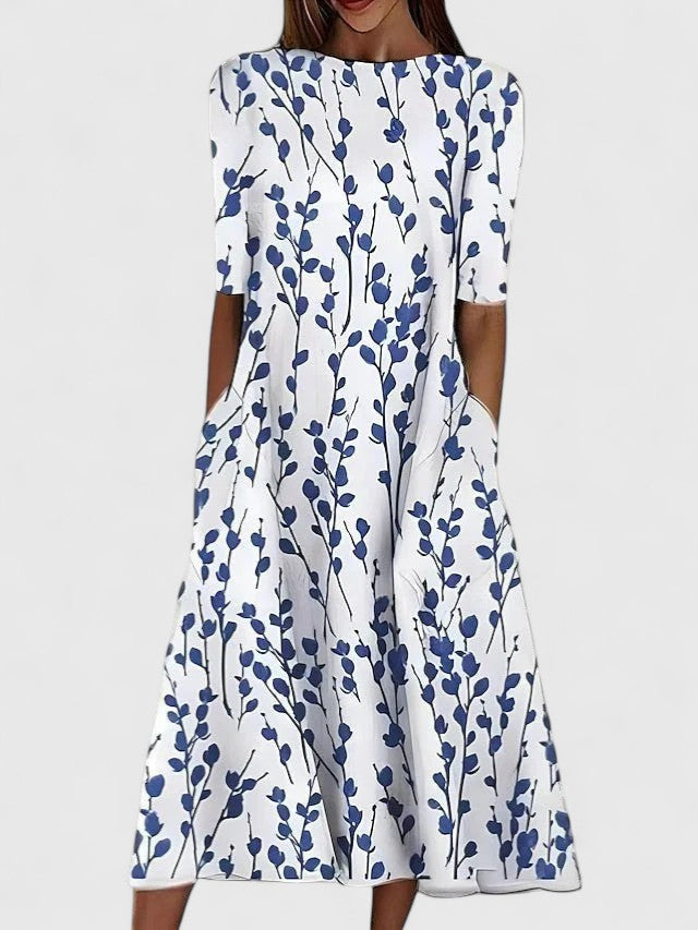Elegant women's floral midi dress, perfect for summer style. Features a comfortable stretch fit & round neckline. Vacation outfit.