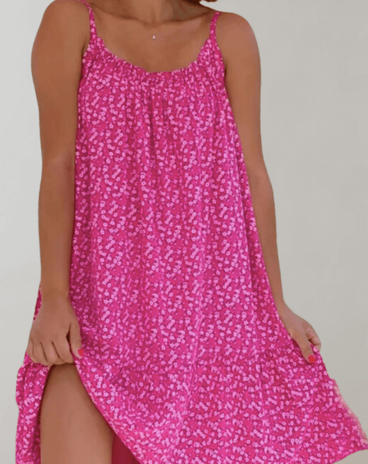 Elegant women's floral midi dress, perfect for summer. Sleeveless A-line cut with a colorful print.