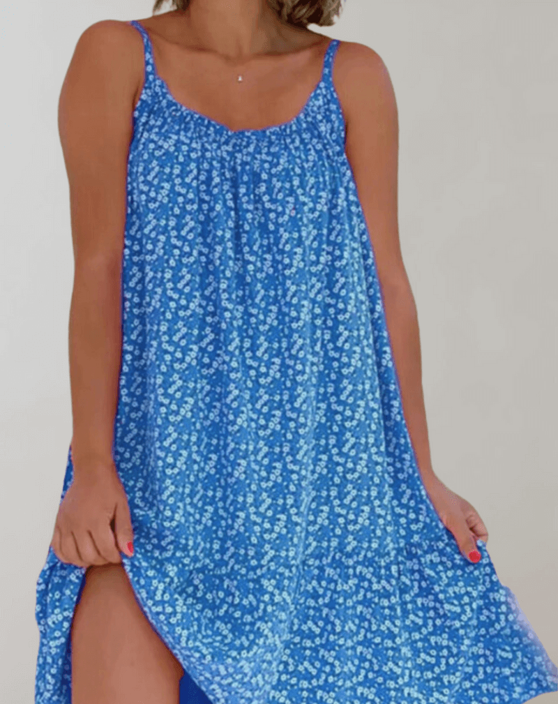 Stylish women's summer midi dress featuring a vibrant floral print. Sleeveless A-line design for comfort.