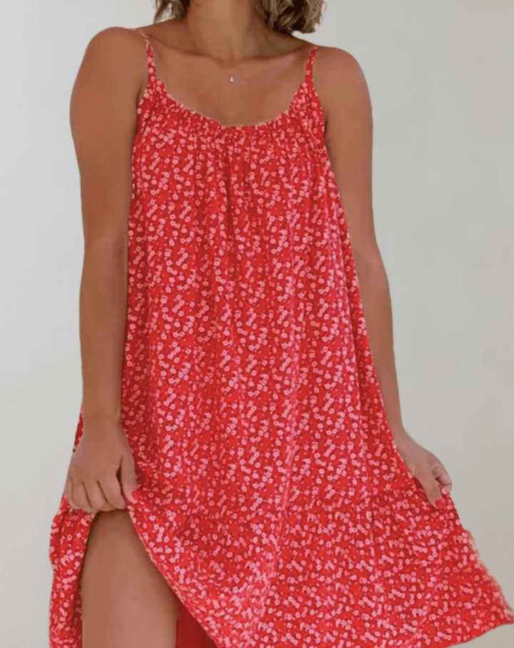 Colorful sleeveless women's midi dress with a beautiful floral print, suitable for summer events or casual wear.