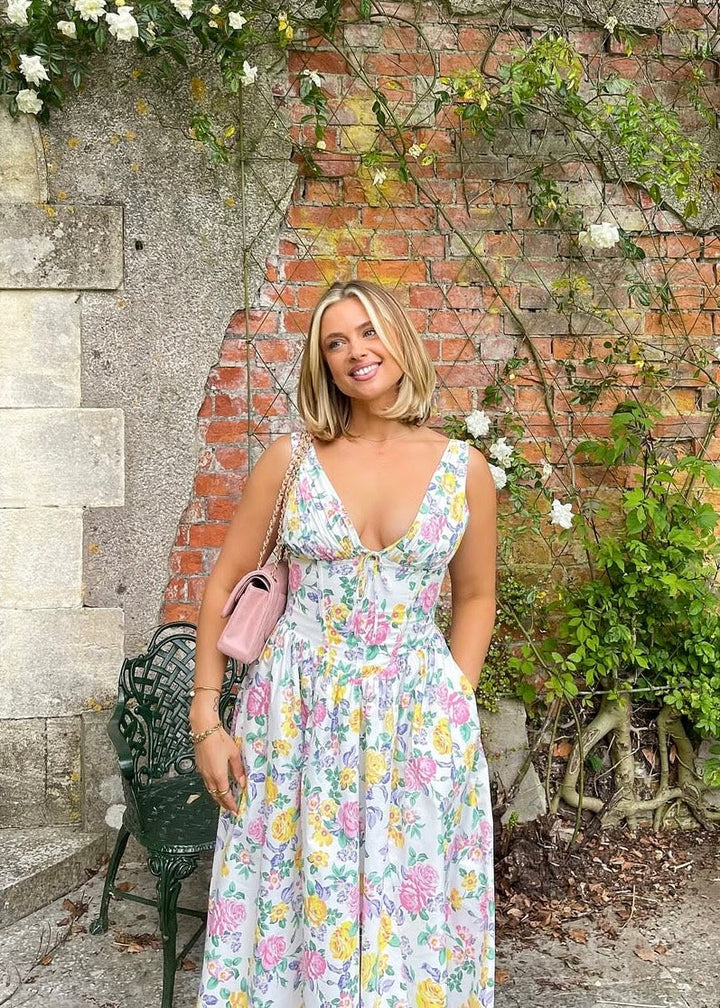 Light and airy women's floral midi dress, perfect for summer events. Elegant party or casual chic style.