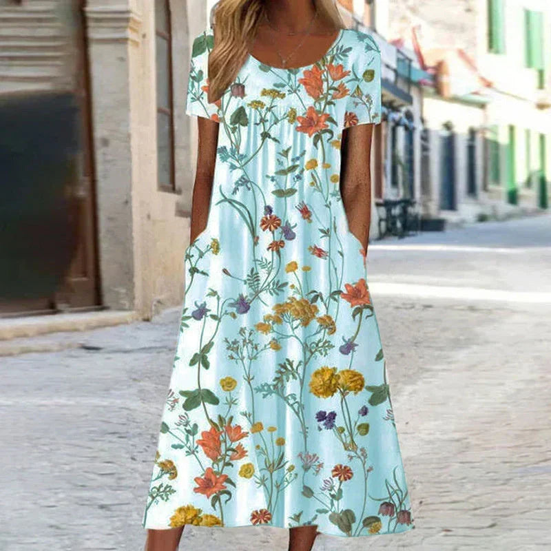 Flowy floral midi dress for women, featuring a comfortable V-neck. Ideal for summer vacations or elegant casual wear.