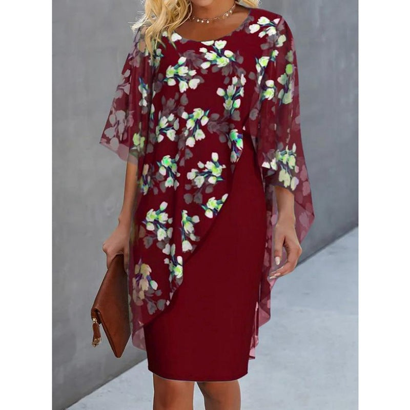 Elegant women's floral midi dress with a flowing cape overlay, perfect for spring and summer party wear.