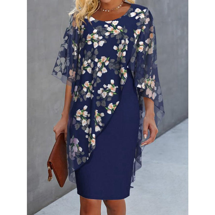 Beautiful floral midi dress for women with an elegant cape overlay, ideal for spring and summer events.