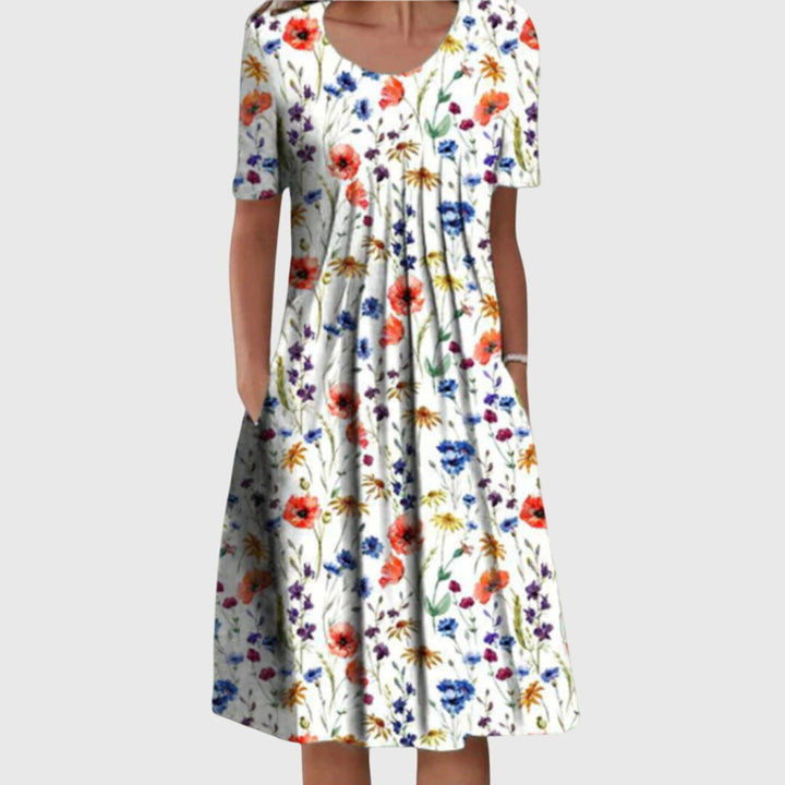 Elegant women's floral midi dress with a round neck, perfect for versatile comfort and summer fashion.