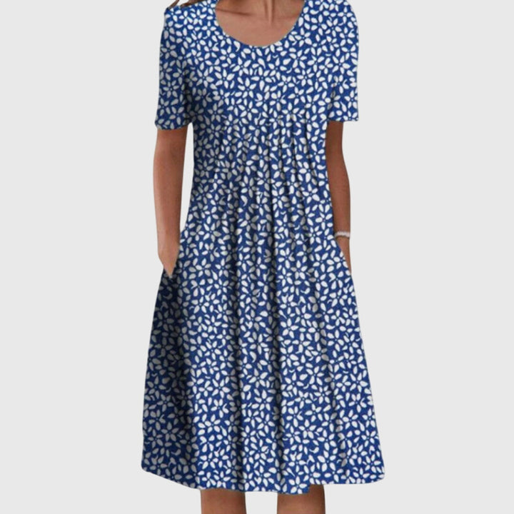 Chic women's elegant round neck dress with a beautiful floral print, a stylish choice for summer fashion.