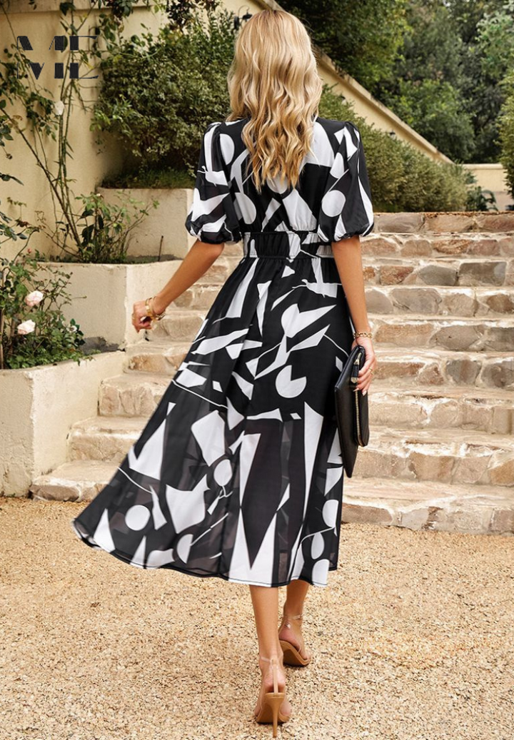 Stylish women's floral midi dress, perfect for summer, with sophisticated puff sleeves & a V-neck cut.