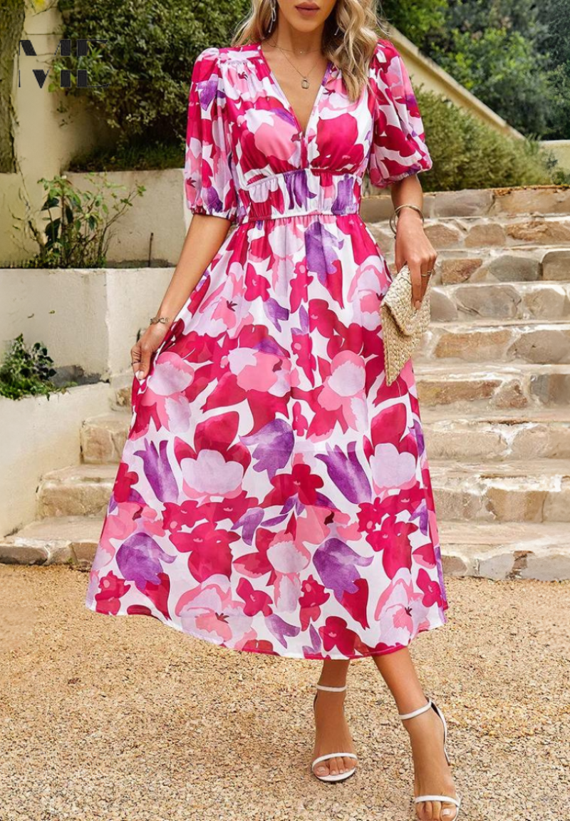 Chic floral midi dress, featuring distinct puff sleeves and a V-neck, an elegant choice for women this summer.