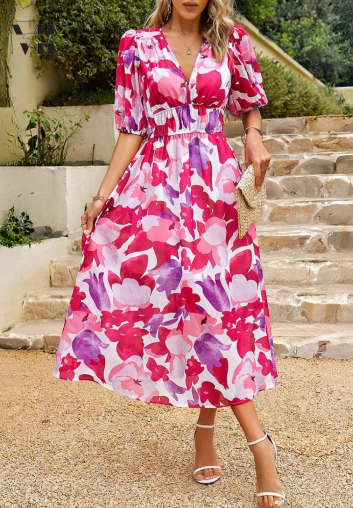 Chic floral midi dress, featuring distinct puff sleeves and a V-neck, an elegant choice for women this summer.