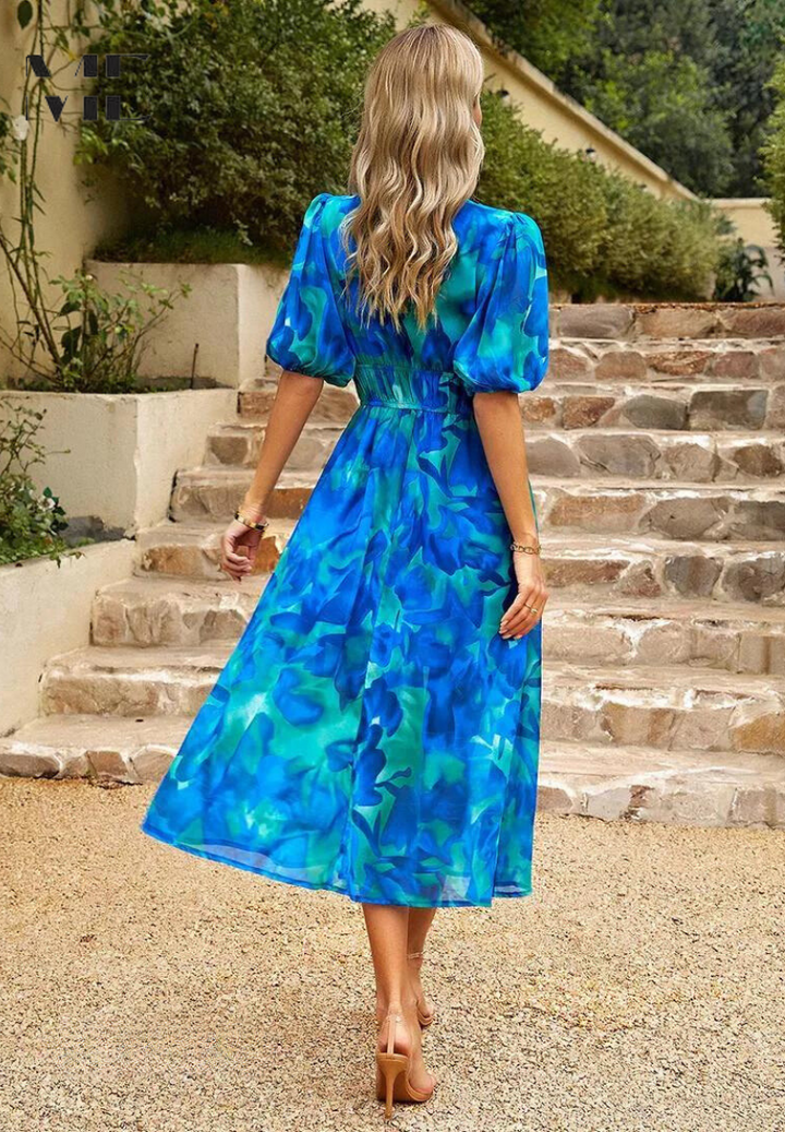 Vibrant floral print midi dress for women, featuring fashionable puff sleeves and a chic V-neck design.