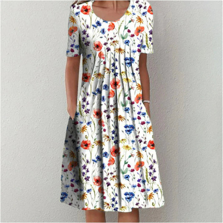 Elegant women's floral midi dress with polka dot accents, perfect for spring/summer events.