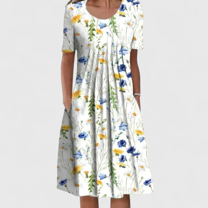 Beautiful women's spring/summer midi dress, featuring an intricate floral & polka dot pattern.