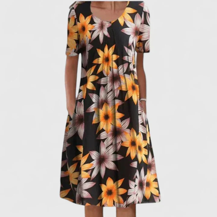 Flowing women's midi dress, perfect for summer, displaying an exquisite floral & polka dot design.