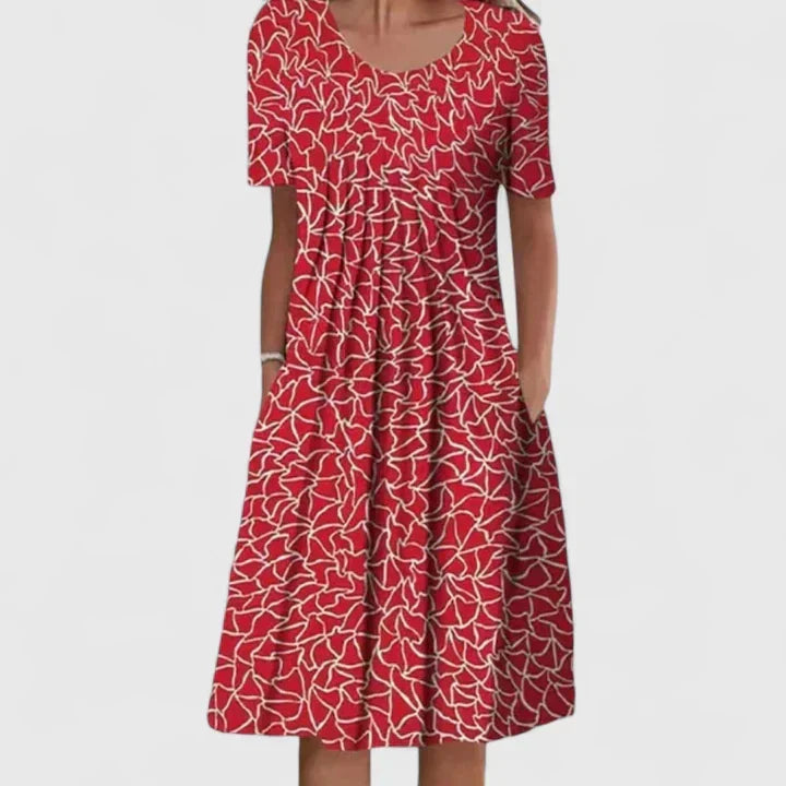 Women's sophisticated midi dress, a chic floral pattern balanced with classic polka dot elements.