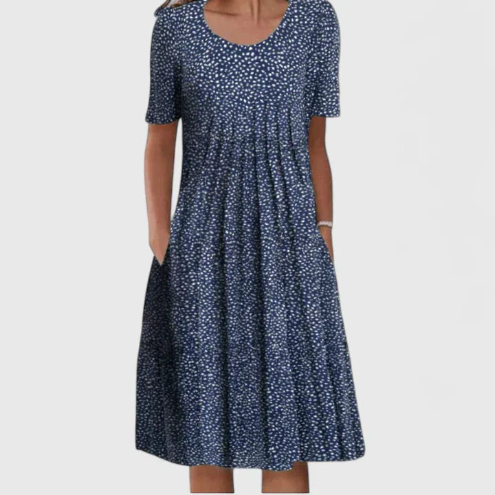 Elegant women's versatile midi dress, combining a lively floral print with subtle polka dots for style.