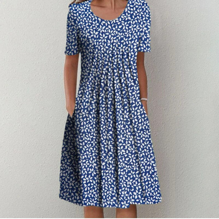 Chic women's floral & polka dot midi dress, ideal for casual summer outings or spring gatherings.