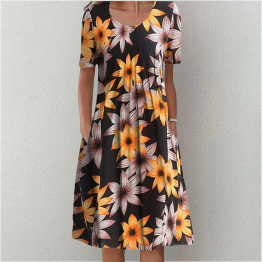 Graceful women's casual midi dress, combining sophisticated floral motifs with classic polka dots.