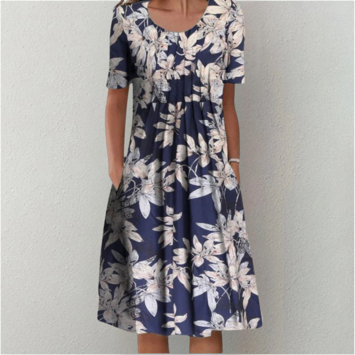 Women's summer midi dress, vibrant floral pattern on a polka dot base, perfect for versatile styling.