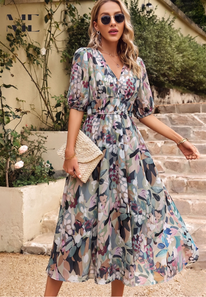 Elegant women's floral midi dress with puff sleeves, perfect for summer occasions. Feminine day-to-night style.