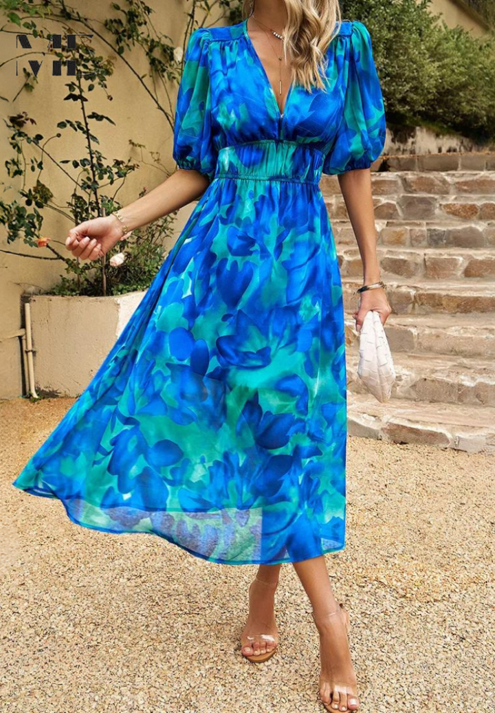 Full length view of a women's elegant floral midi dress with puff sleeves, perfect for summer spring fashion.
