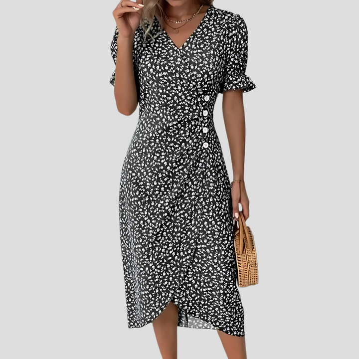 Breezy floral midi dress for women, ideal as a summer beach or vacation dress with a flattering A-line cut.