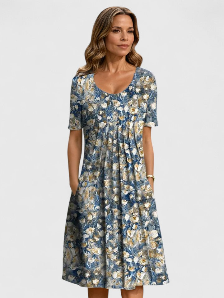Chic women's floral summer dress with practical pockets, ideal for versatile party or casual wear.