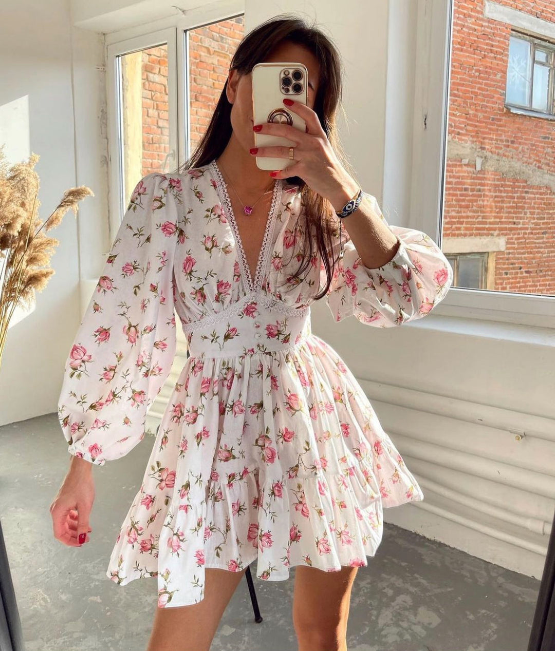 Elegant women's floral mini summer dress with a V-neck and ruffles, perfect for casual parties or vacation.