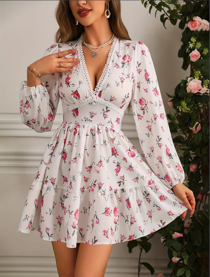 Stylish A-line floral mini dress for women, featuring a V-neck and delicate ruffles, ideal for summer outings.