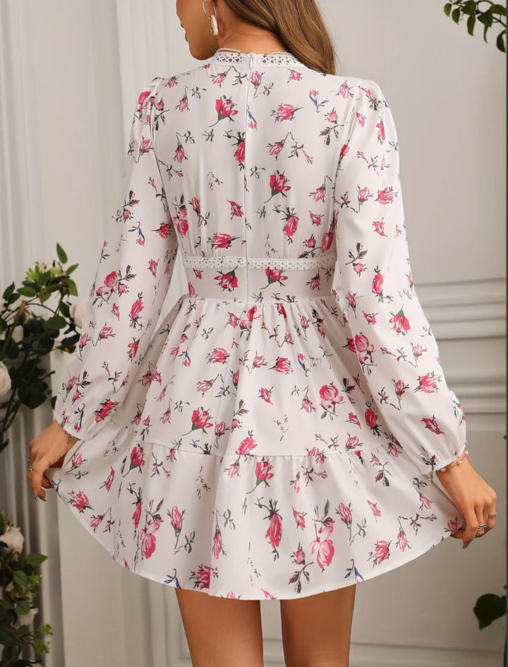 Lovely women's floral print mini summer dress with an elegant V-neck and playful ruffles, perfect for warm days.