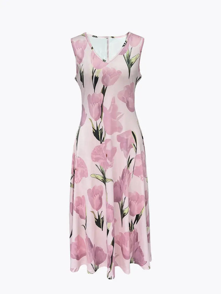 Full-length view of women's elegant pink floral maxi dress & matching jacket set. Stylish formal or party ensemble.