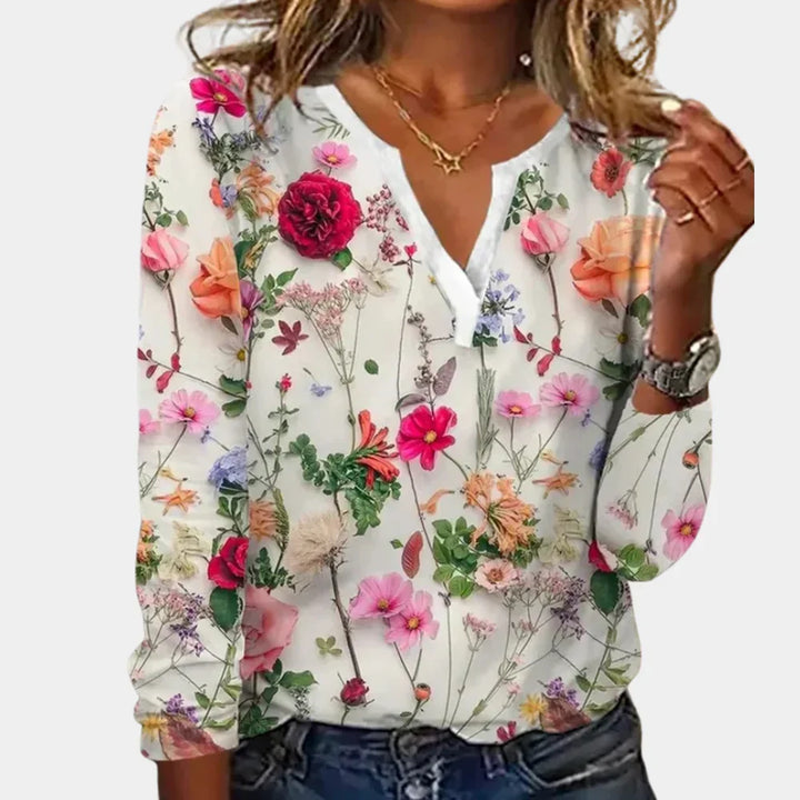 Chic women's floral print blouse, ideal for office or evening. Stylish long sleeve top for elegant spring fashion.