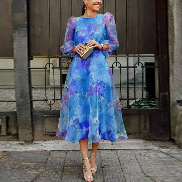 Chic women's summer midi dress with vibrant floral print. Elegant blue & pink design for spring parties.