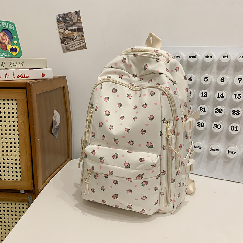 Stylish women's floral print backpack with vibrant design, ideal for school, travel, or daily use. Water-resistant.