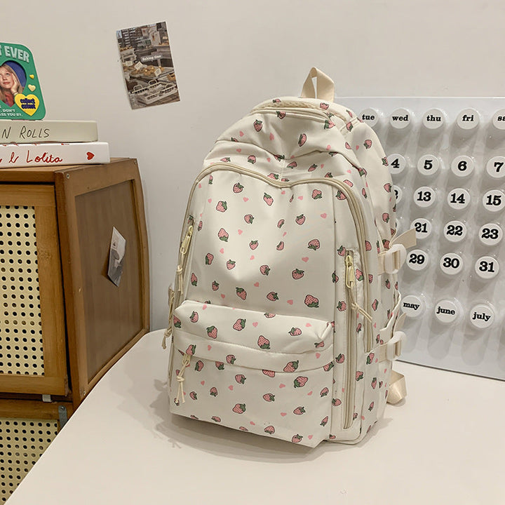 Stylish women's floral print backpack with vibrant design, ideal for school, travel, or daily use. Water-resistant.
