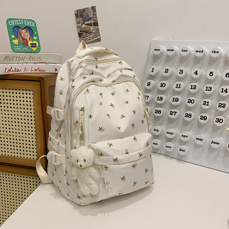 Durable water-resistant floral print backpack for women, perfect for school, travel, and everyday elegance.