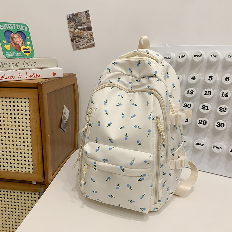 Fashionable women's floral print daypack, elegant & practical for school or travel, comfortable and spacious.