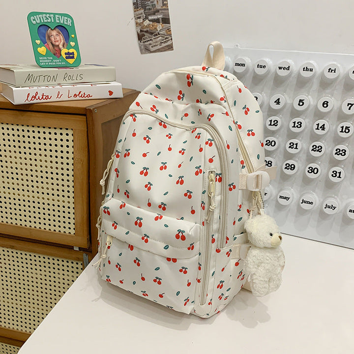 Versatile women's floral print backpack, ideal as a school daypack or stylish travel bag. Durable water-resistant fabric.