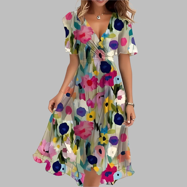 Stylish women's midi dress featuring vibrant floral print & flattering ruching, ideal for spring occasions.