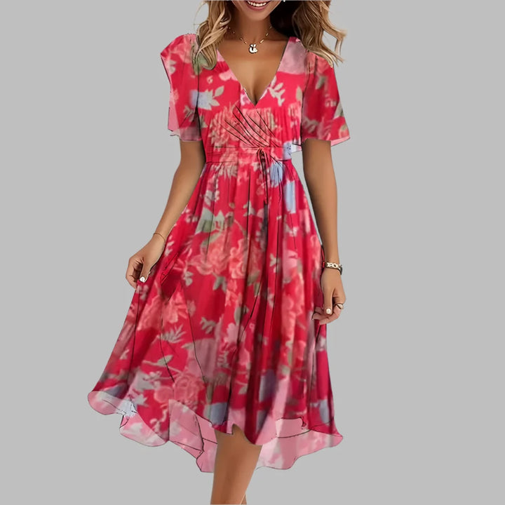 Women's elegant floral midi dress, ruched for a flattering fit. Perfect short sleeve party or date night dress.